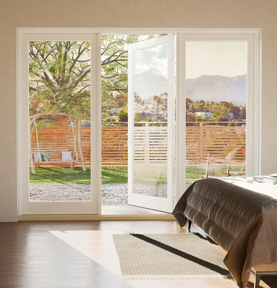 Interior view of a white three-panel Marvin Replacement inswing French door.